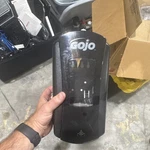 Gojo Black Wall-mount Soap & Sanitizer Dispenser For Use. Fixed Price $15.00.