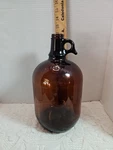 Vintage Antique Amber Brown Glass Jug Bottle Finger Loop One Gallon Clean. Fixed Price $35.99.