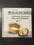 New Glacier Bay Garbage Disposal Rim And Stopper Stainless Steel Matte Gold. Fixed Price $15.99.